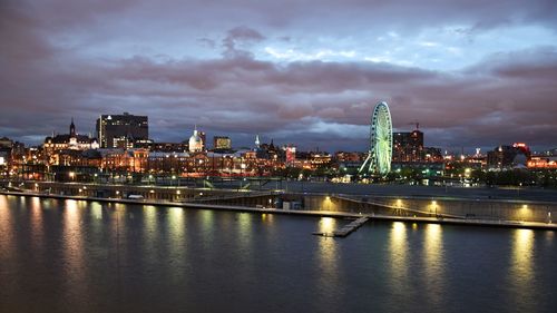 Illuminated buildings at waterfront