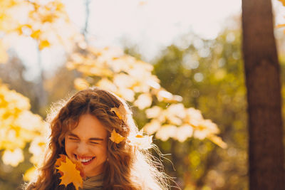 Portrait of young woman in park