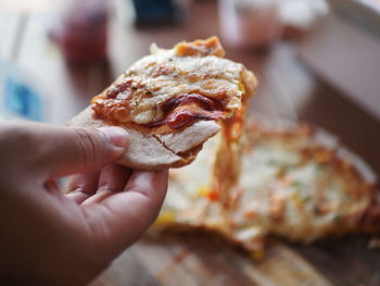 Close-up of hand holding food