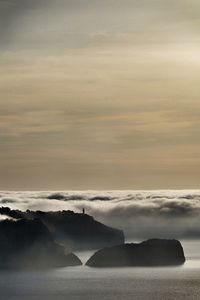 Scenic view of sea against dramatic sky