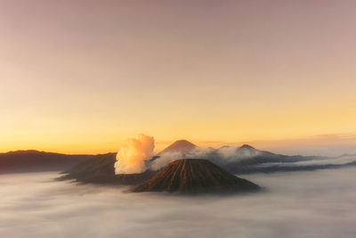 Aerial view of volcanic landscape against sky during sunset