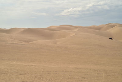 Atv off-road all terrain vehicles driving over the sand dunes for entertainment and recreation