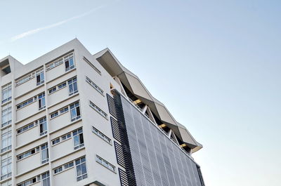 Low angle view of modern building against clear sky