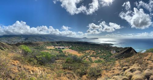 Panoramic view of land and sea against sky