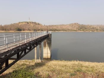 Bridge over river against sky