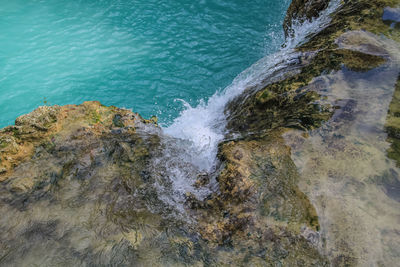 High angle view of rocks in sea