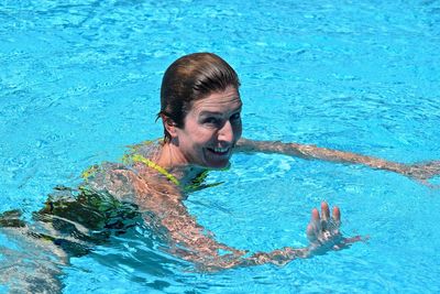 Portrait of woman swimming in pool