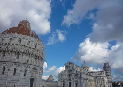 Low angle view of building against cloudy sky