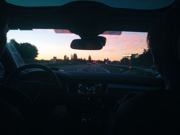 Cars on road seen through car window