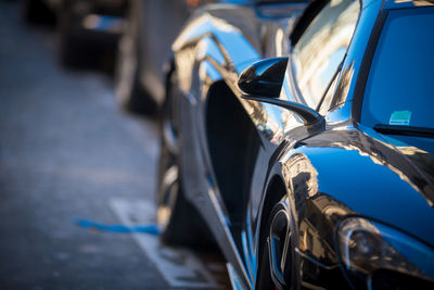 Close-up of vintage car on street