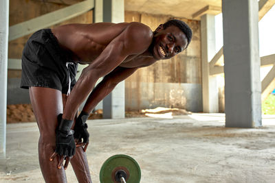 Low section of man exercising in gym