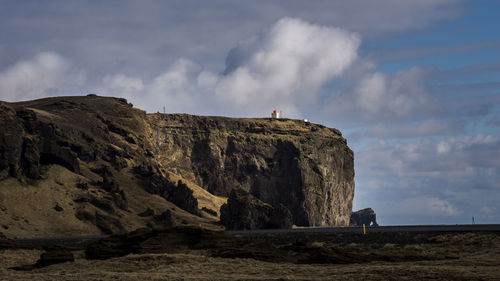 Rock formations on landscape against sky