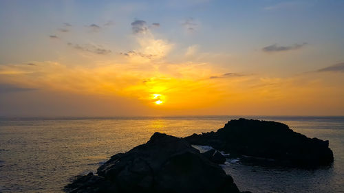 Scenic view of sea against sky during sunset