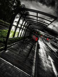 Cars on bridge against sky