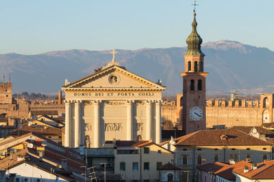 View of buildings in city against sky