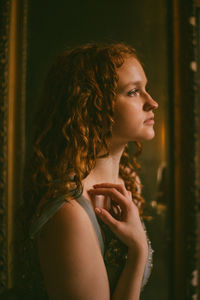 Portrait of a young woman looking away
