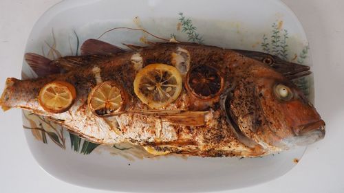 High angle view of fish in plate on table