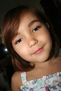 Close-up portrait of a smiling young girl