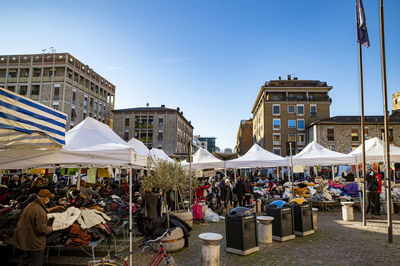 People at street market against sky