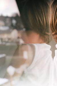 Girl seen through glass window