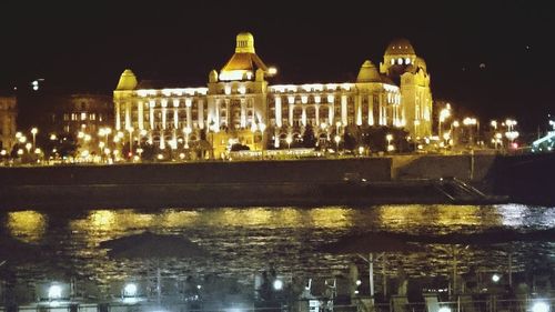 Reflection of illuminated buildings in water