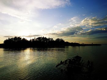 Scenic view of lake at sunset