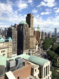 Modern buildings in city against sky