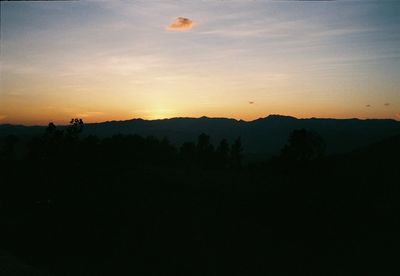 Scenic view of silhouette landscape against sky during sunset