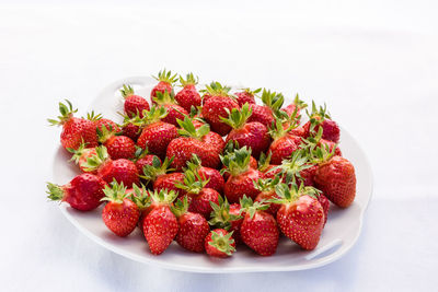 Close-up of strawberries against white background