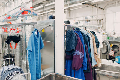 Close-up of clothes hanging in store