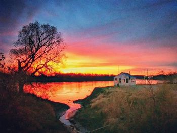 Scenic view of lake at sunset