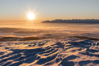 Scenic view of landscape against sky during sunset