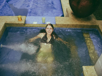 Portrait of woman swimming in pool