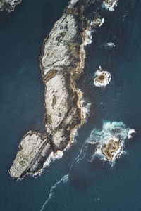 Aerial view of rock formation in sea