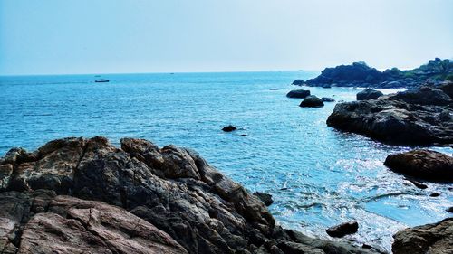 Scenic view of sea against clear blue sky