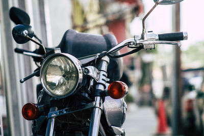 Close-up of motorcycle on street