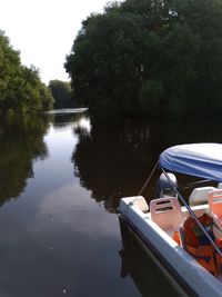 Boats moored in lake