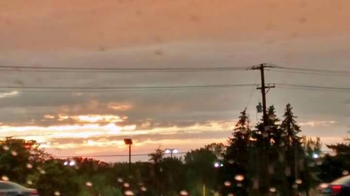 sunset, sky, power line, electricity pylon, electricity, cloud - sky, tree, power supply, silhouette, nature, orange color, cable, beauty in nature, low angle view, dusk, connection, tranquility, technology, street light, cloudy