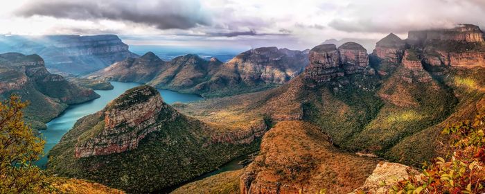 Panoramic view of mountains against cloudy sky