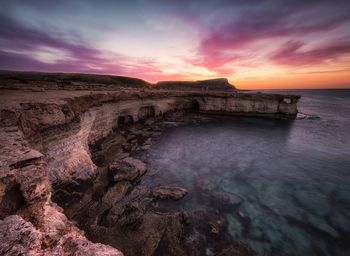 Scenic view of sea against sky during sunset