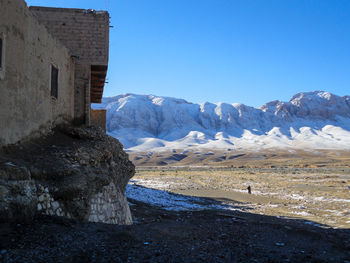 Scenic view of mountains against clear sky during winter