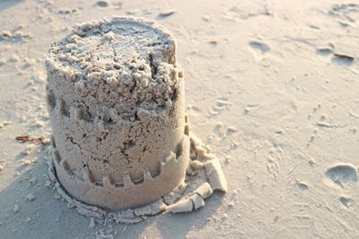 High angle view of sandcastle at beach