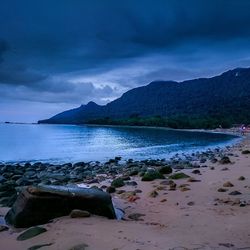 Scenic view of sea against cloudy sky