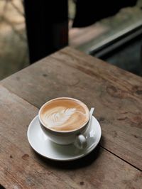 High angle view of coffee cup on table