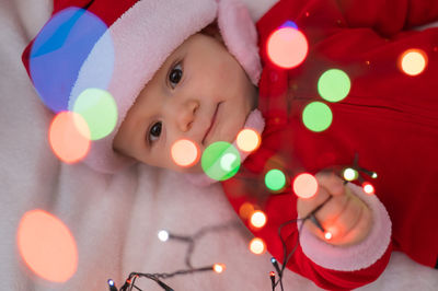 High angle view of cute girl with christmas decoration