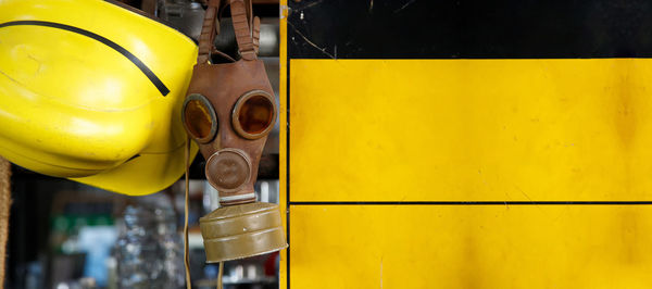 Close-up of yellow car on street