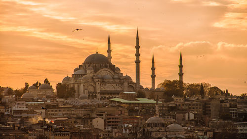 Panoramic view of buildings against sky during sunset