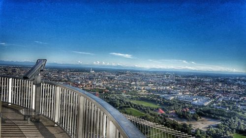 View of cityscape against blue sky