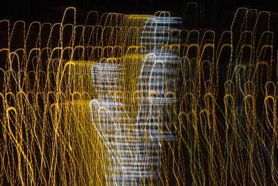 Illuminated lights on field at night