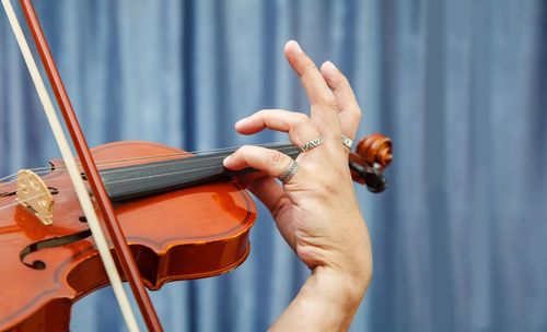 Cropped image of woman playing violin